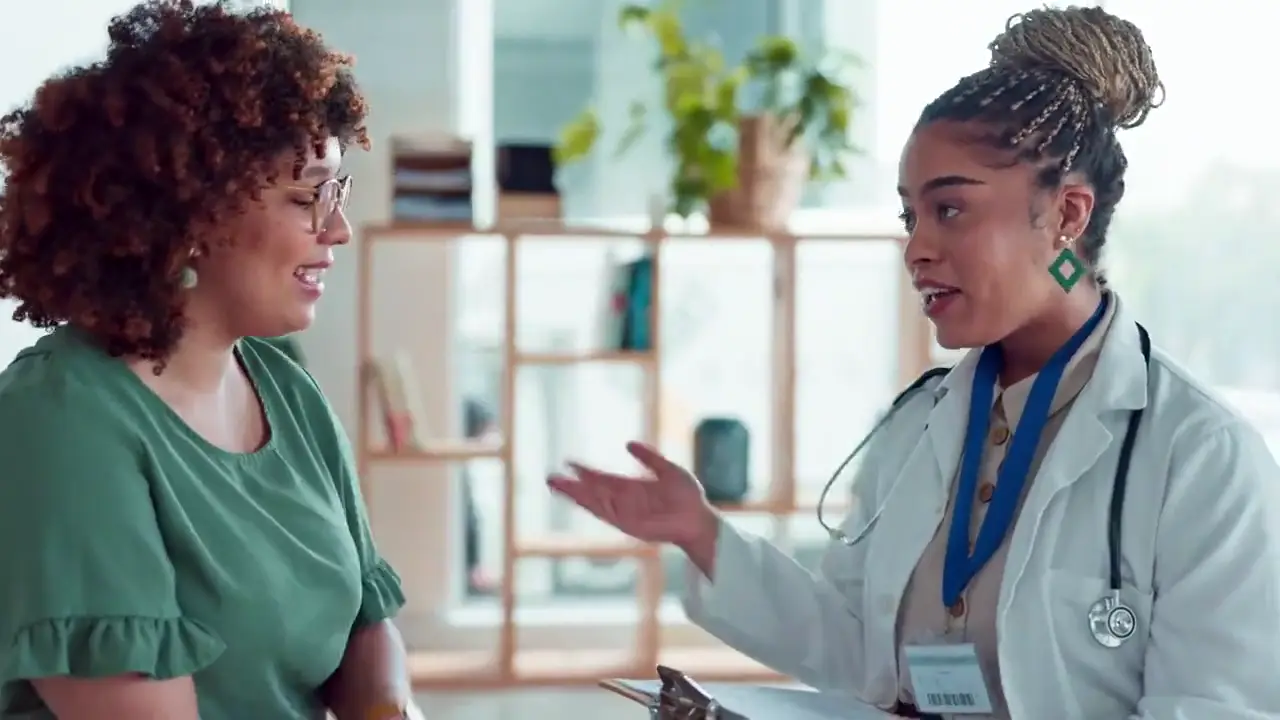 A Welo doctor chatting with an employee at work